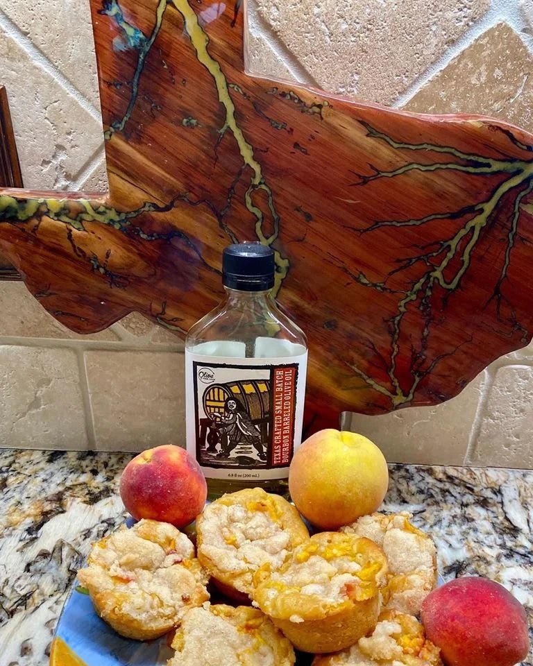 Bourbon Barreled Olive Oil by Olive These Foods – small - batch /olive - oil - with my Texas cutting board